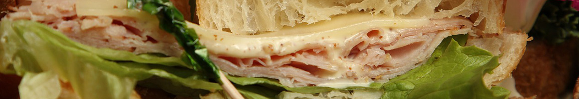 Eating Sandwich at Williston Coffee Shop restaurant in Williston, VT.